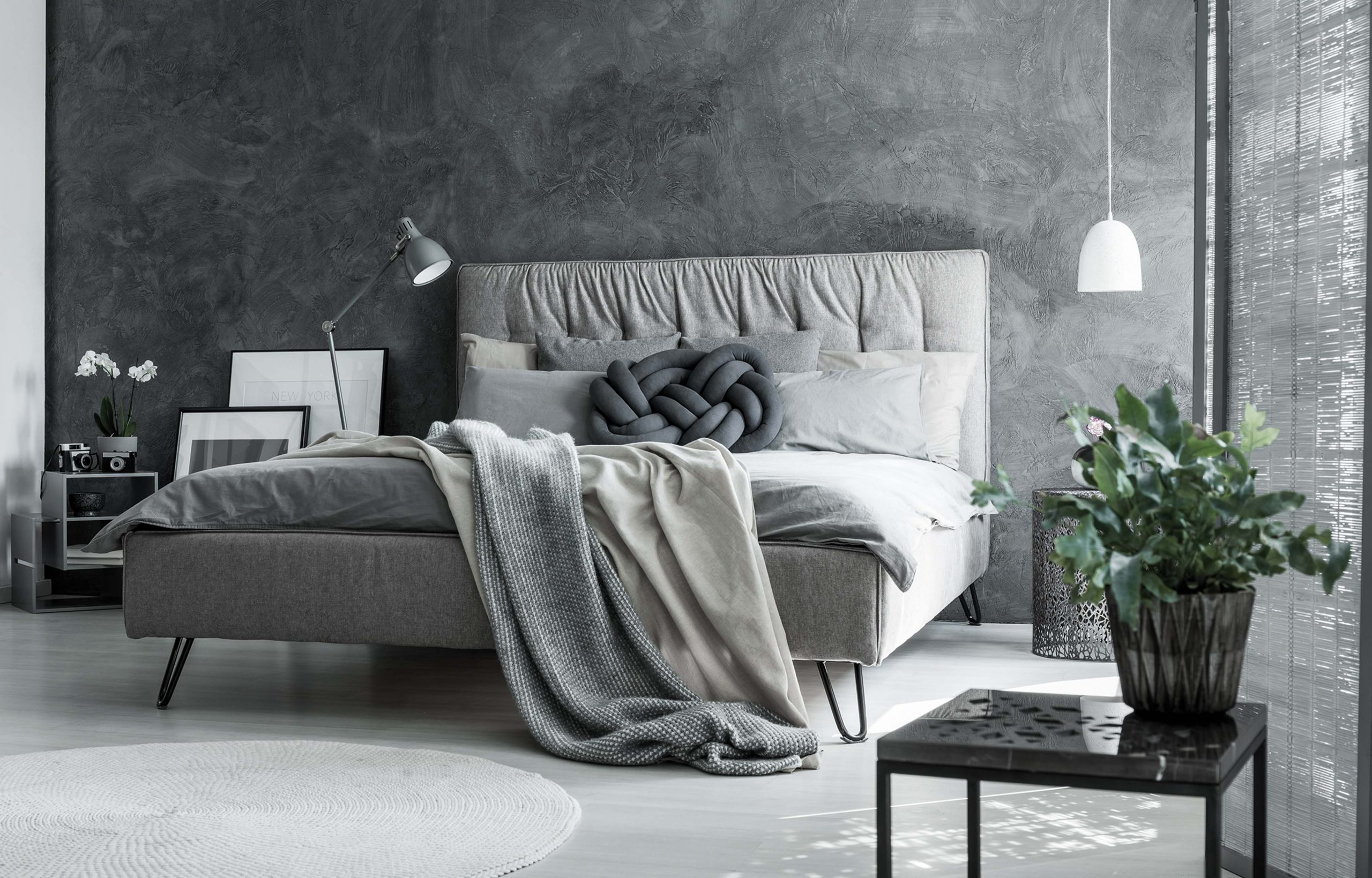 Gray bedroom with handmade pillow